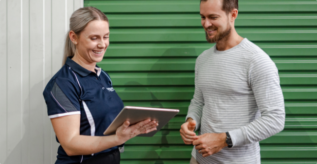 People standing outside of a Fort Knox Storage unit