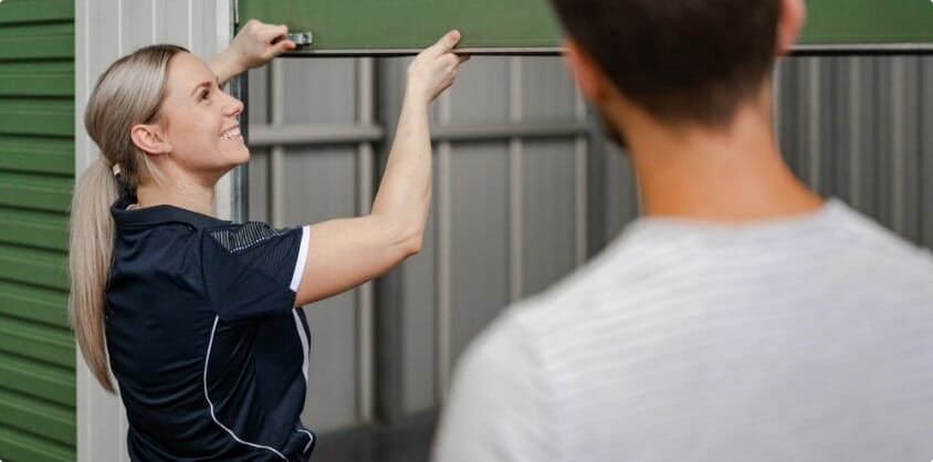 A Fort Knox Storage employee opening a storage unit