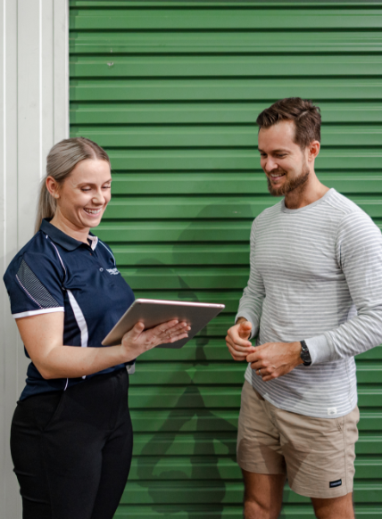 People standing outside of a Fort Knox Storage unit
