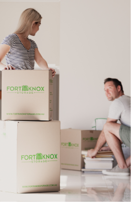 People packing items into Fort Knox Storage boxes