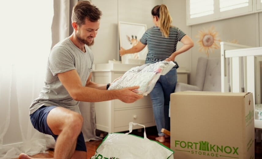 People packing items into a Fort Knox Storage box