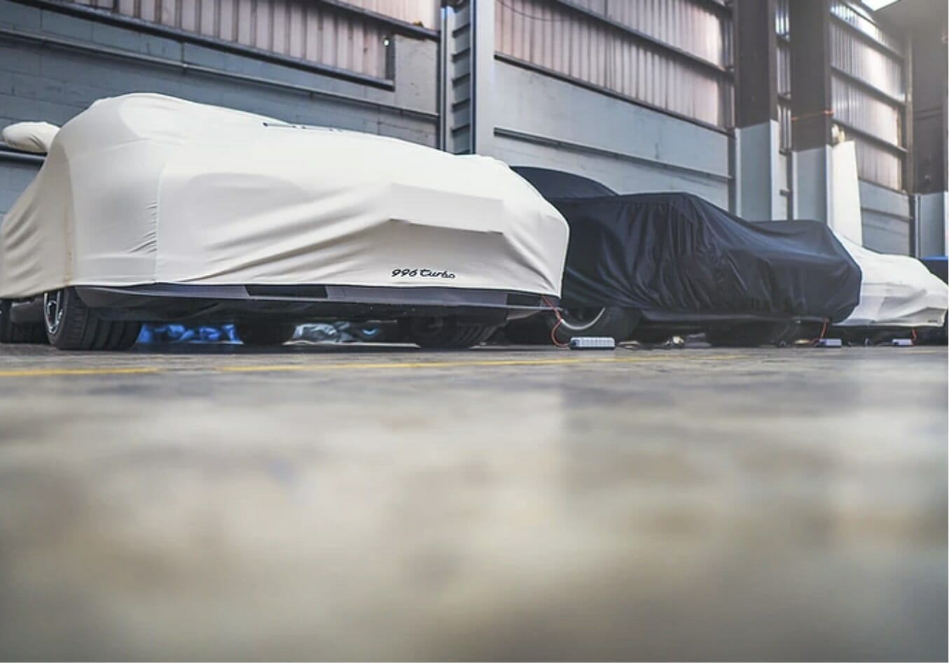 Multiple cars parked within a storage facility