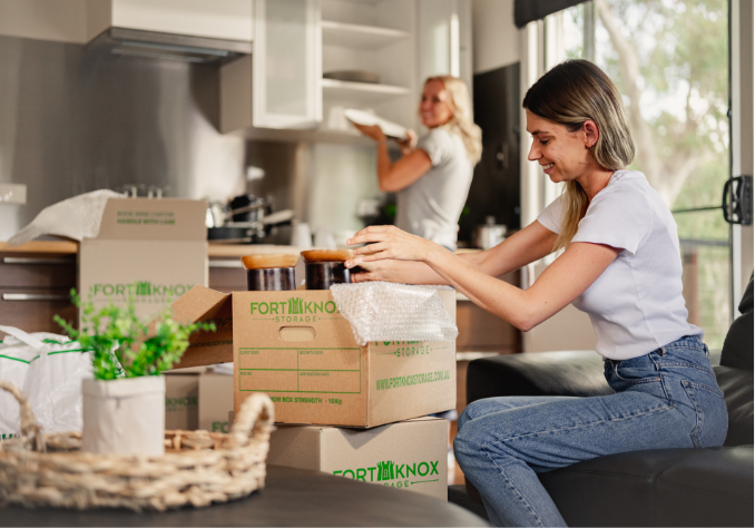 Group 553@2x People packing items into Fort Knox Storage boxes