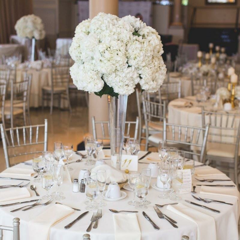 A decorated table with a floral centrepiece