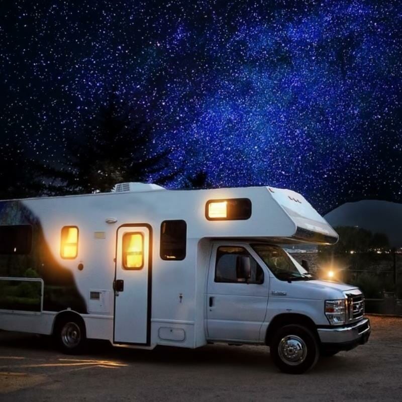 A caravan underneath starlight